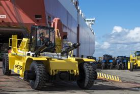 A tractor rolls off of a RoRo ship